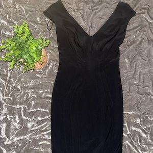 Worn once, black form fitting dress, stretches.